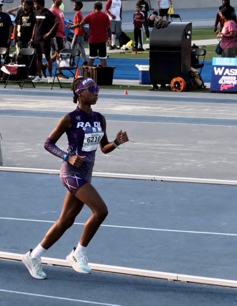 Alexa Hardy running on the track in her purple RADL uniform