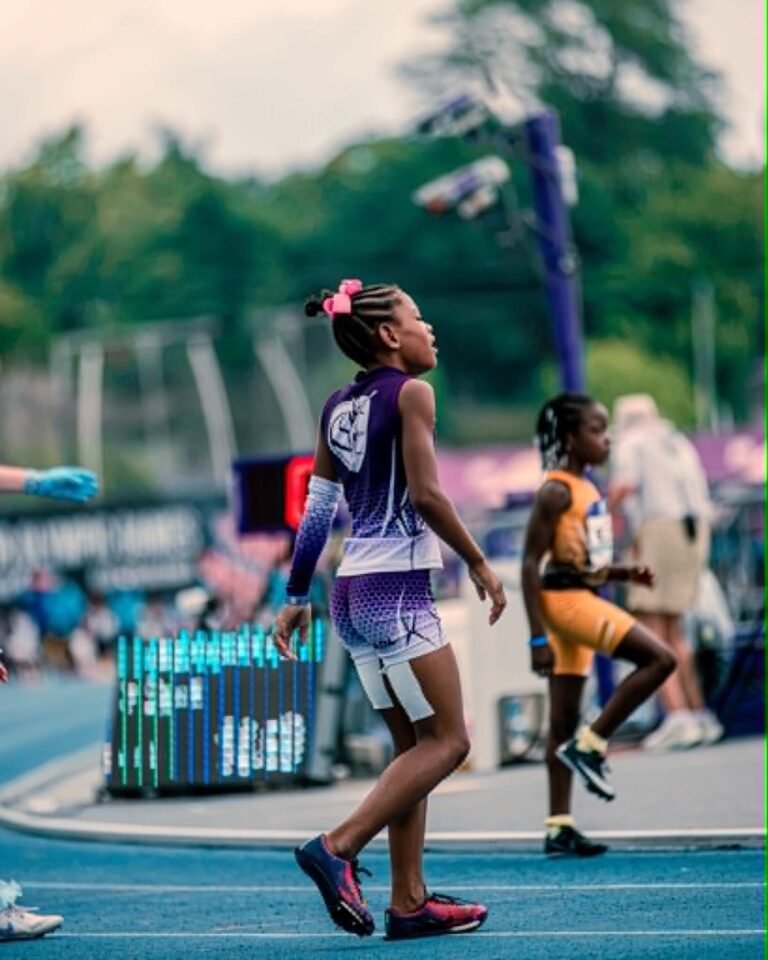 Kari “Lucy” Smith wearing her RADL Track Club uniform on the track.